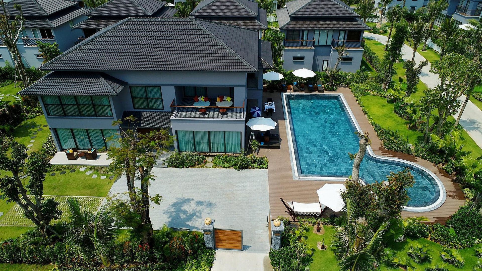 Aerial view of a hospitality property with pool